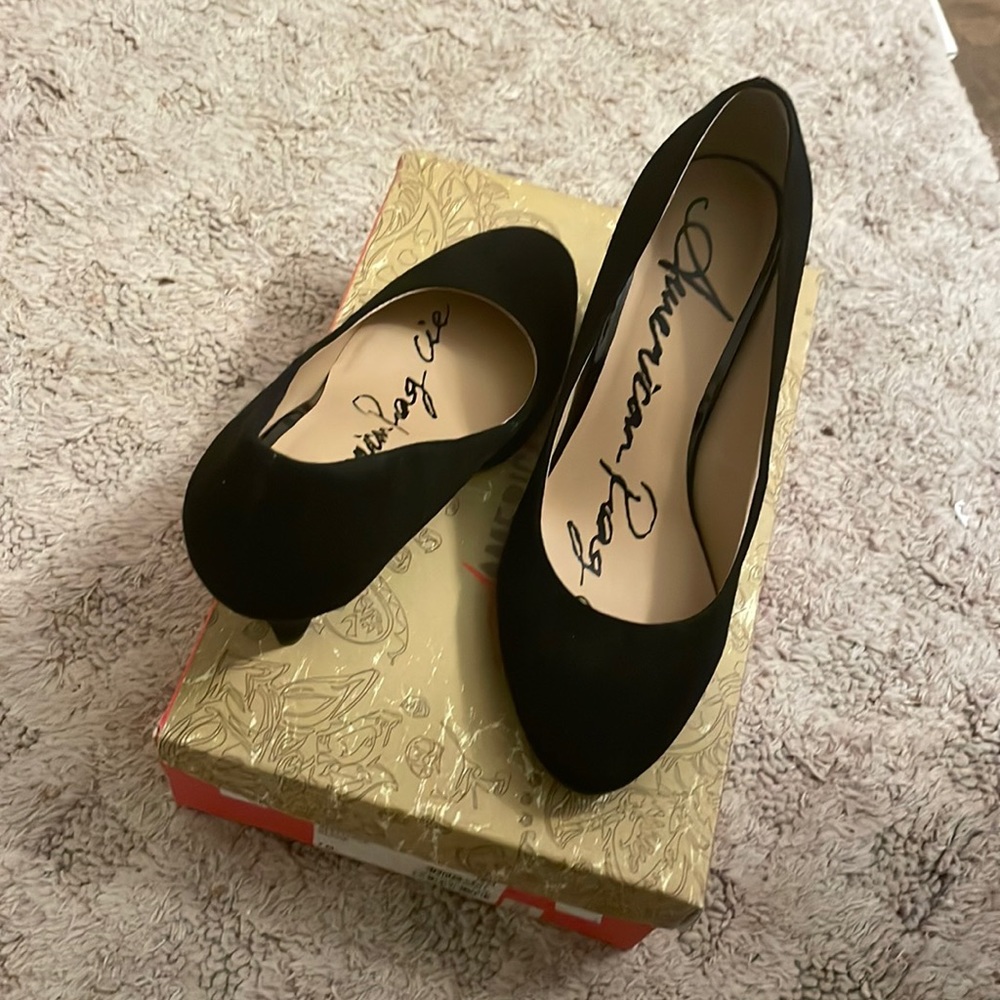 Black American rage shade heels 2 inches used once with box size 7 m
